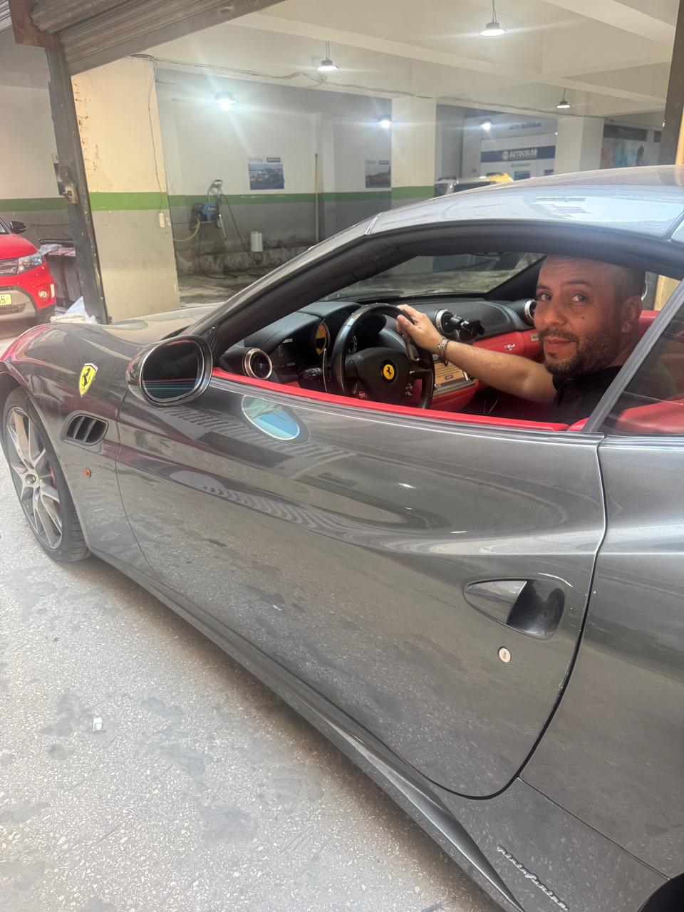 Raffi Halvadjian at the wheel of a Ferrari