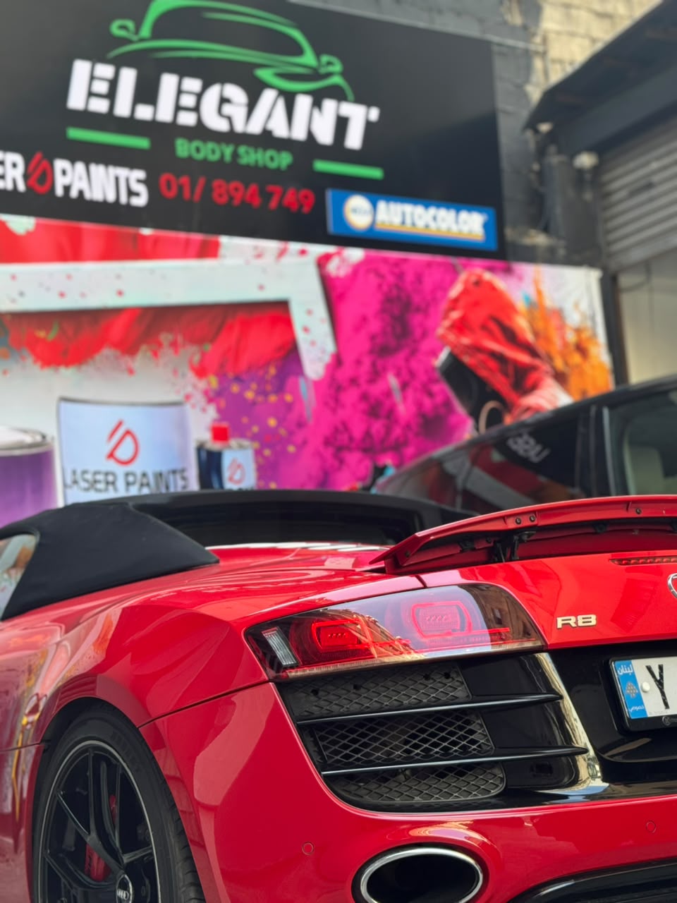 Red Audi R8 outside Elegant Body Shop